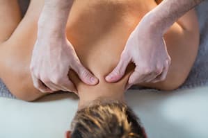 Neck massage to a boy