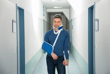 Portrait Of Disabled Man Standing In Hospital
